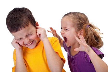 Kids quarrel - little girl shouting in anger