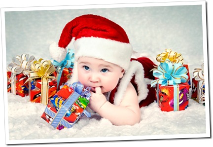 Cute little santa baby with New year’s gifts